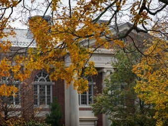 autumn leaves over Davidson College building