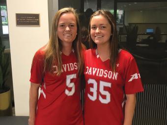 Sisters Olivia and Julianne Carey in Davidson Lacrosse Uniforms