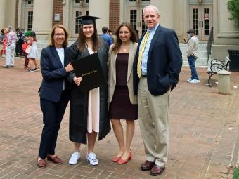 Photo of Julia Miller ’21 and her family at commencement
