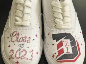 Photo of shoes decorated by Julia Miller with "Class of 2021" and large Davidson slashed D
