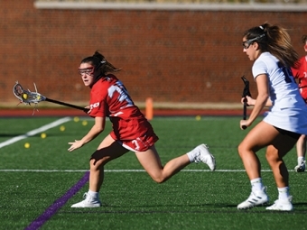 Julianne Carey playing lacrosse