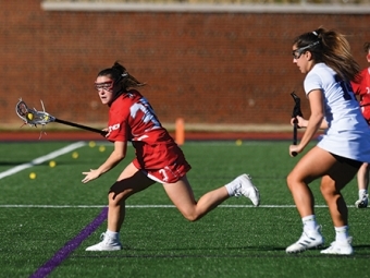 Julianne Carey playing lacrosse