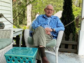 Charles Cornwell ’61 on house porch