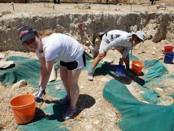 Olivia Doran and Harrison Dinsbeer excavating at Athienou