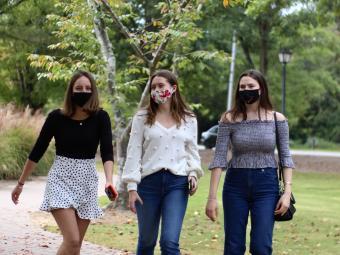 Friends Walking & Laughing on Campus Wearing Masks