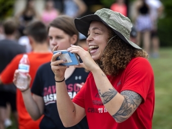 Person Laughs While Recording the Cake Race