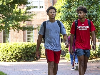 Two Students Walking on Campus