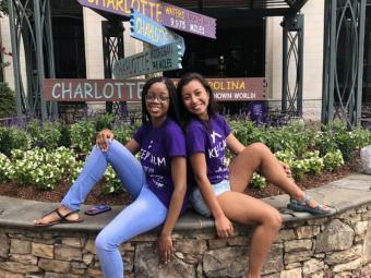 Davidson Freedom School Interns DaShanae and Yara in matching purple shirts