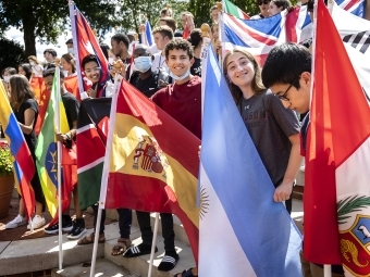 International students holding country flags