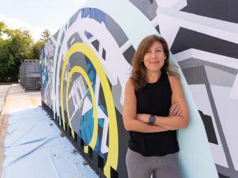 Davidson College Prof. Joelle Dietrick poses by mural project at Dickinson College