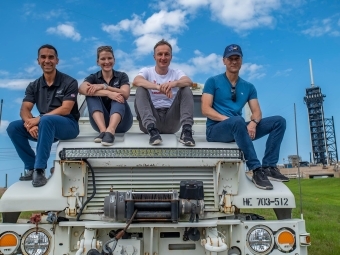 Astronauts sitting on spacecraft vehicles