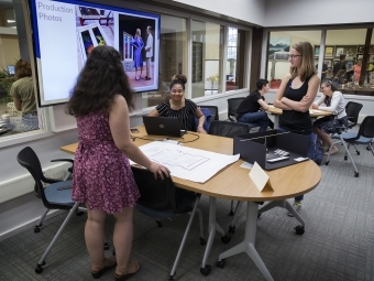 Faculty and students at a presentation 