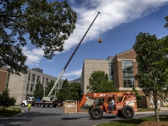 Davidson greenhouse construction ground view with construction truck and raised lever