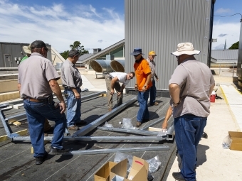 construction on the roof of Wall Center for the greenhouse