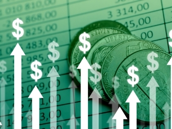 Arrows with dollar signs pointing upwards with spreadsheet ad coins in background