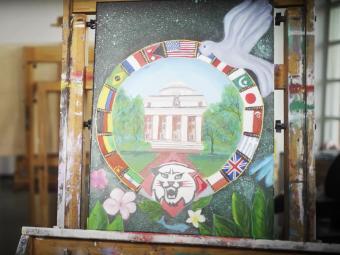Student painting in the 2021 holiday video