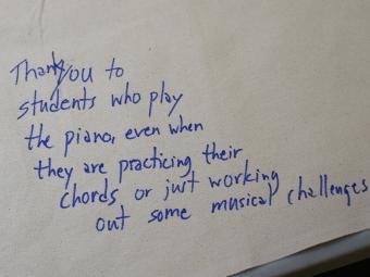A thank you note that reads "Thank you to students who play the piano even when they are practicing their chords or just working out some musical challenges."