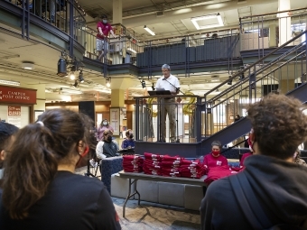 Alvarez Union Director Mike Goode speaks to students watching at 20th anniversary celebration