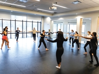 Professor Dasha Chapman teaching a Haitian dance class