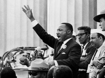 Dr. Martin Luther King Jr. delivering speech to crowd