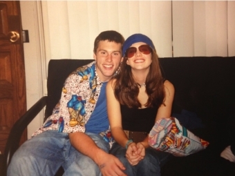 Andrea with sunglasses and David smiling on couch as students