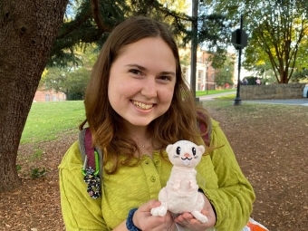 Carson Crochet '22 Posing with Plush Mole Rat