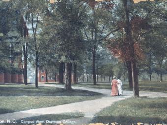archival postcard of two women walking outside on Davidson's campus