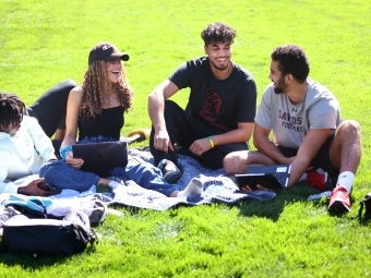 Admission Welcome -- Students Laughing on the green