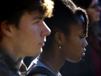 close-up of two students at Ukraine vigil on campus