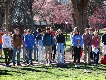 gathering of students outside for campus vigil for Ukraine