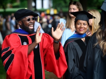 Class of 2020 Commencement professor waving to grad