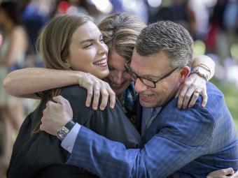 Commencement Class of 2020 Parents hug their recent grad