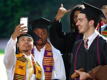 Group of students taking selfie at Commencement for Class of 2022