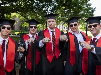 Group of students showing their rings at Class of 2022 Commencement