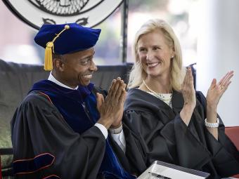 Professor Philip Jefferson and Trustee Alison Hall Mauze clapping at Class of 2022 Commencement