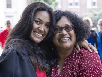Graduate with family member at Class of 2022 Commencement