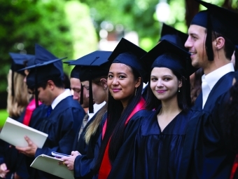 Class of 2020 students line up at their Commencement in 2022