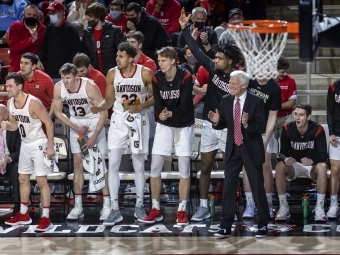 Basketball Game Players and Coach McKillop