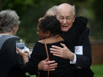 Alumni hugging at reception