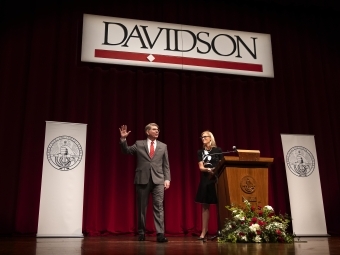 President Doug Hicks and Trustee Allison Mauze on stage