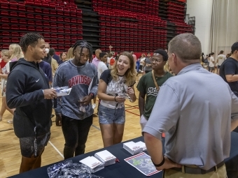 Students meeting with staff at 2022 Orientation Fair