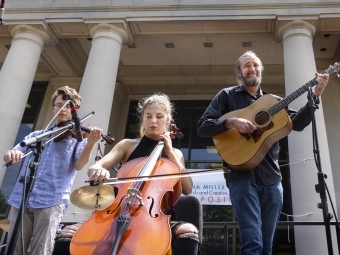 students and faculty playing musical instruments