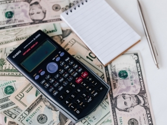 image of calculator and money