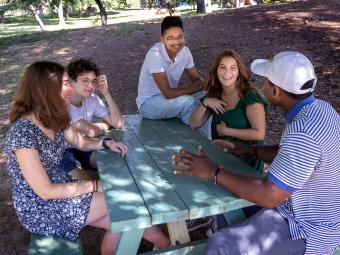 group of friends at picnic table