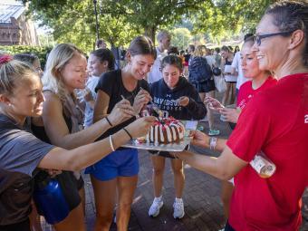 Students dig into cake at 2022 Cake Race