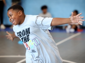 Student running and smiling