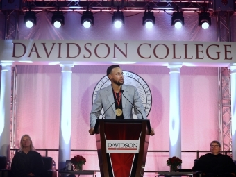 Steph Curry speaks at the podium during the Curry for 3 Event