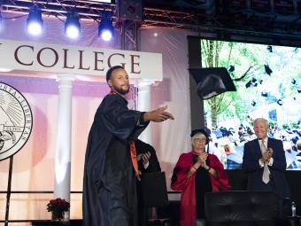 Stephan Curry in tossing graduation cap