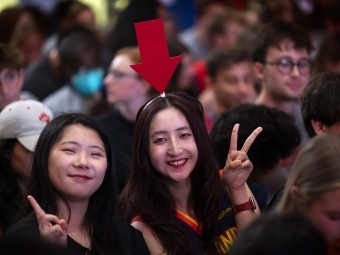 Two students wearing costumes