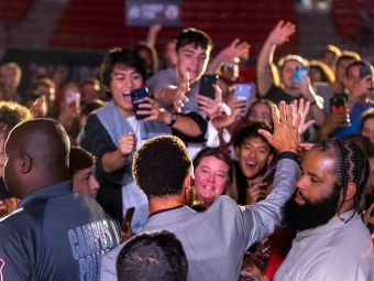 Curry greeting students during Curry for 3 Event